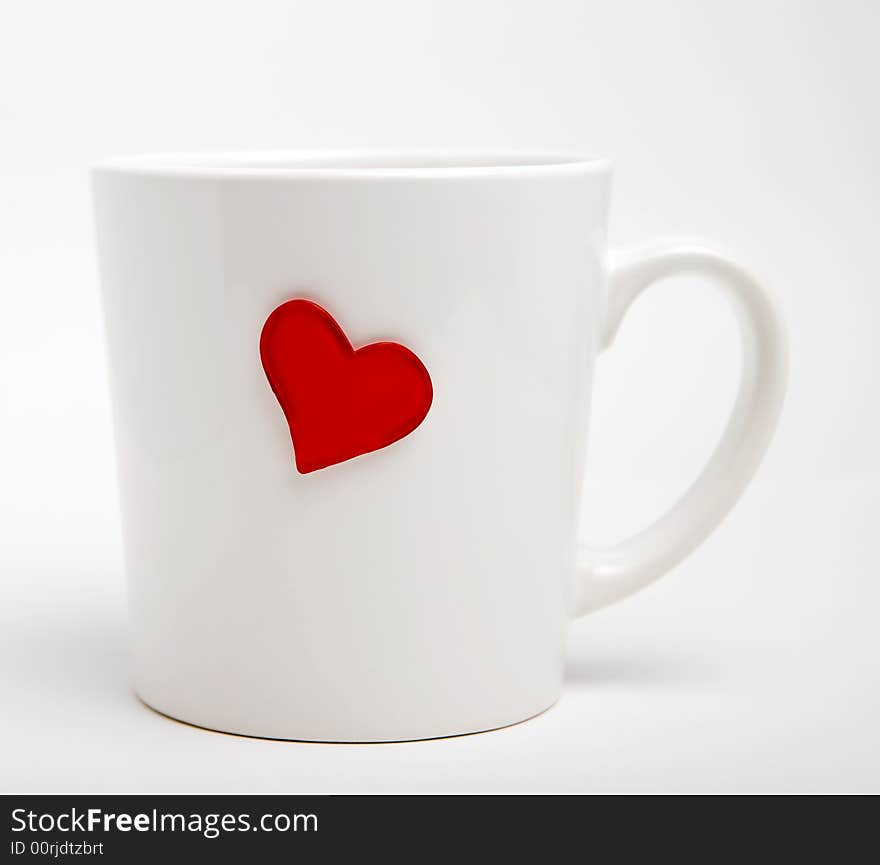 Cup with heart isolated