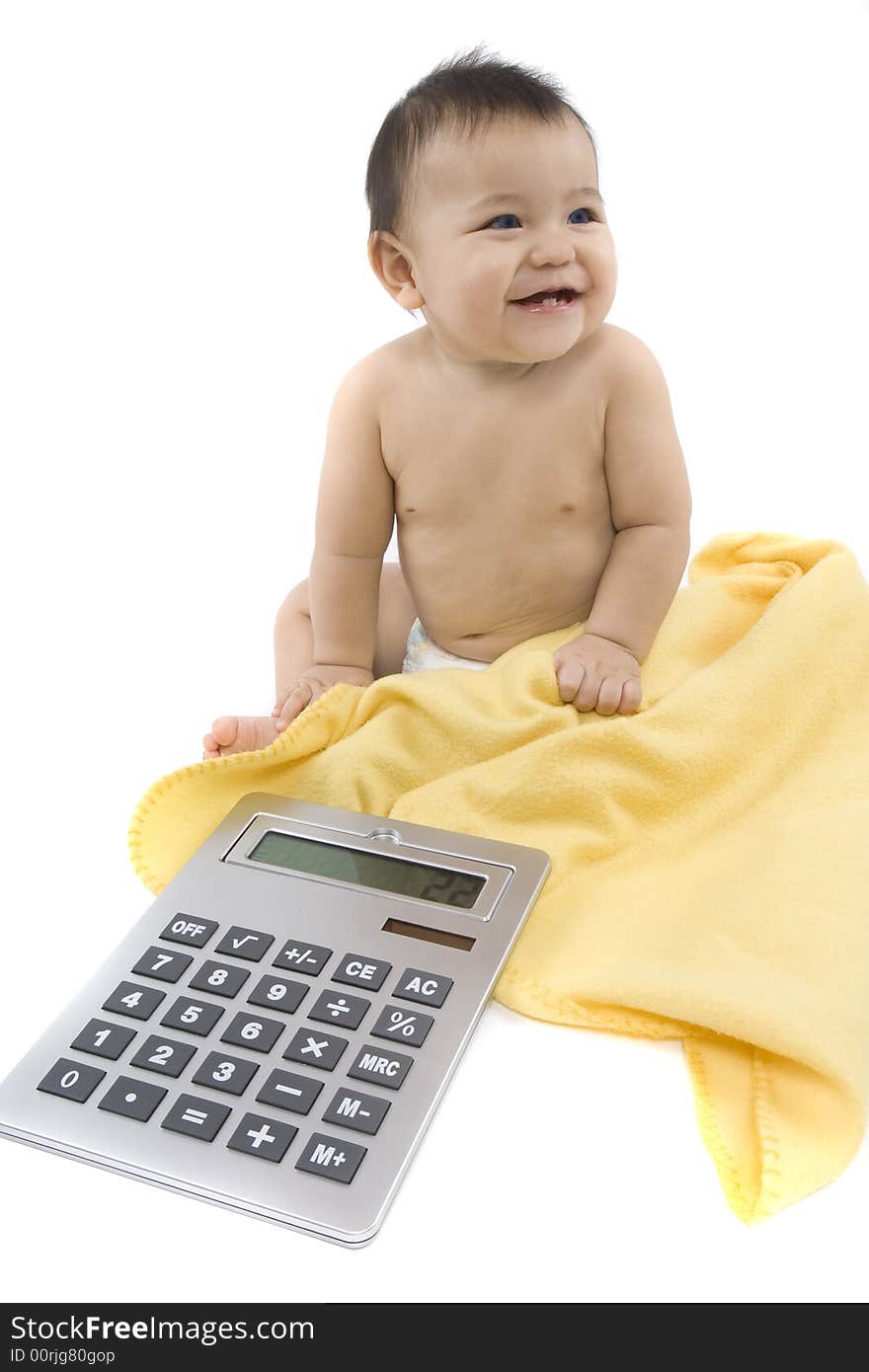 9-month delightful baby with a big pocket calculator  over a white background. 9-month delightful baby with a big pocket calculator  over a white background