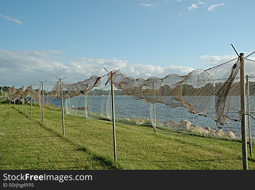 Fishing nets are on land ready for repair.