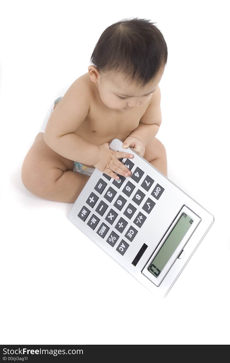 9-month delightful baby with a big pocket calculator  over a white background. 9-month delightful baby with a big pocket calculator  over a white background