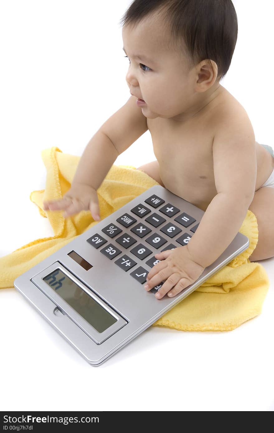 9-month delightful baby with a big pocket calculator  over a white background. 9-month delightful baby with a big pocket calculator  over a white background