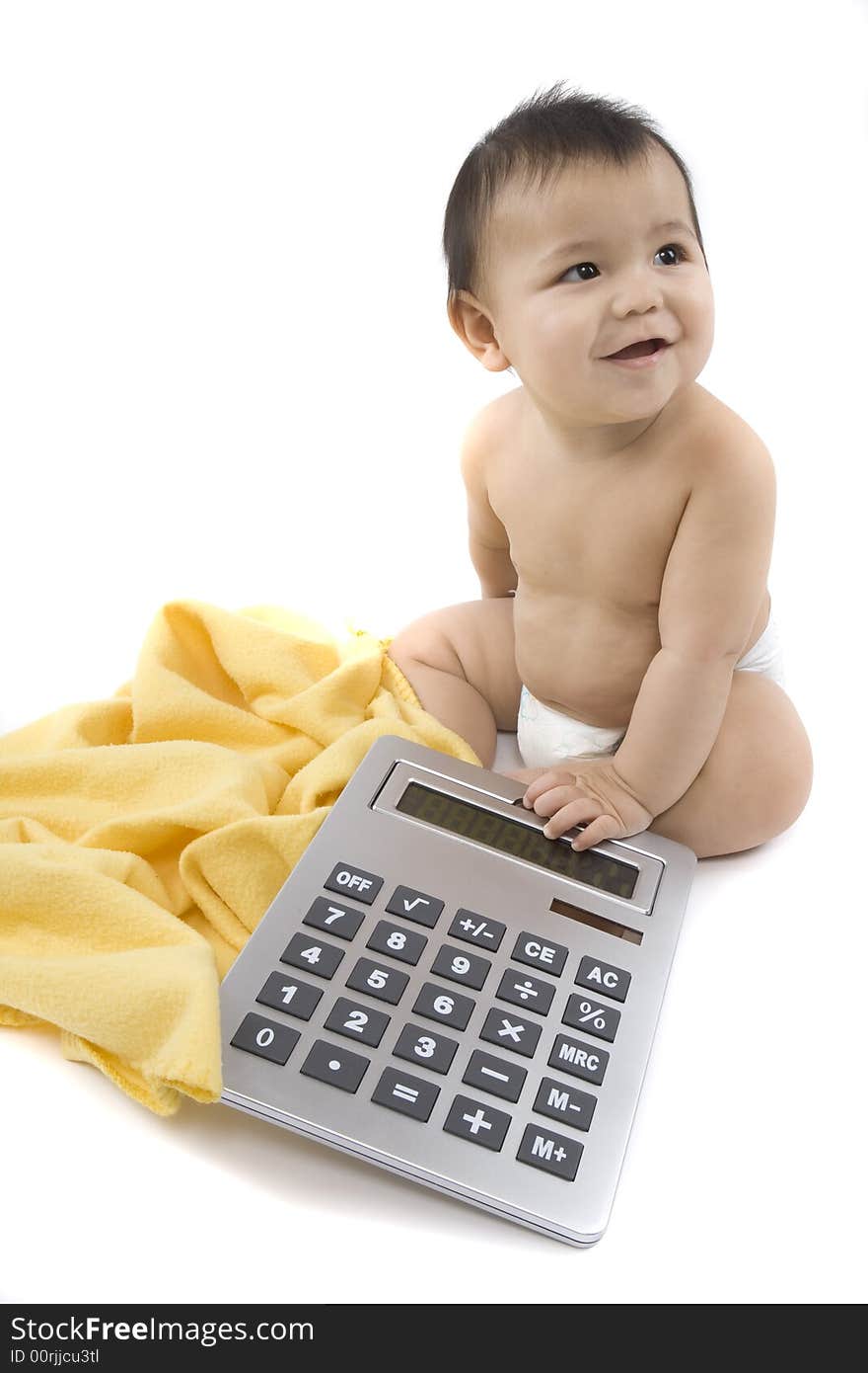 9-month delightful baby with a big pocket calculator  over a white background. 9-month delightful baby with a big pocket calculator  over a white background