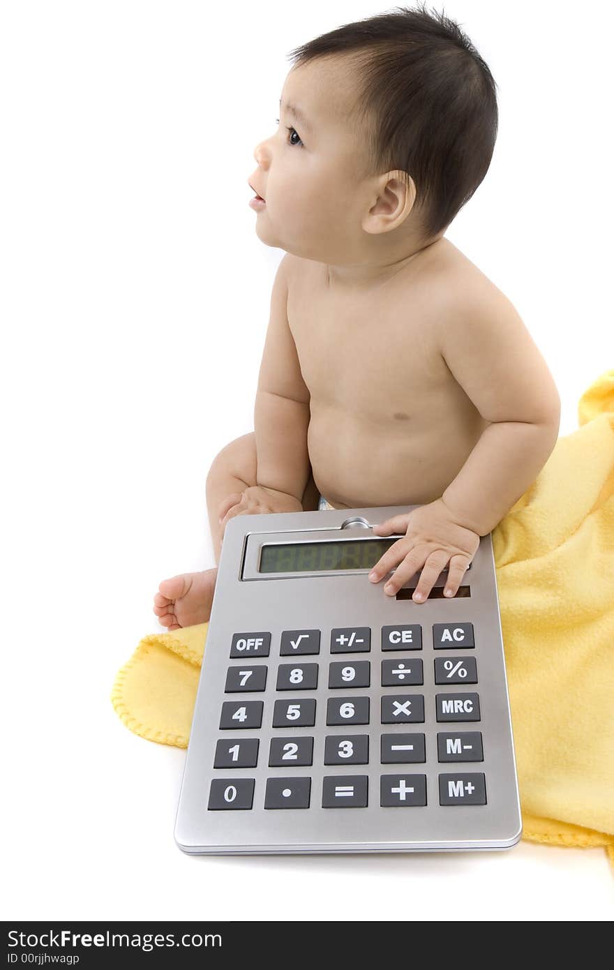 9-month delightful baby with a big pocket calculator  over a white background. 9-month delightful baby with a big pocket calculator  over a white background