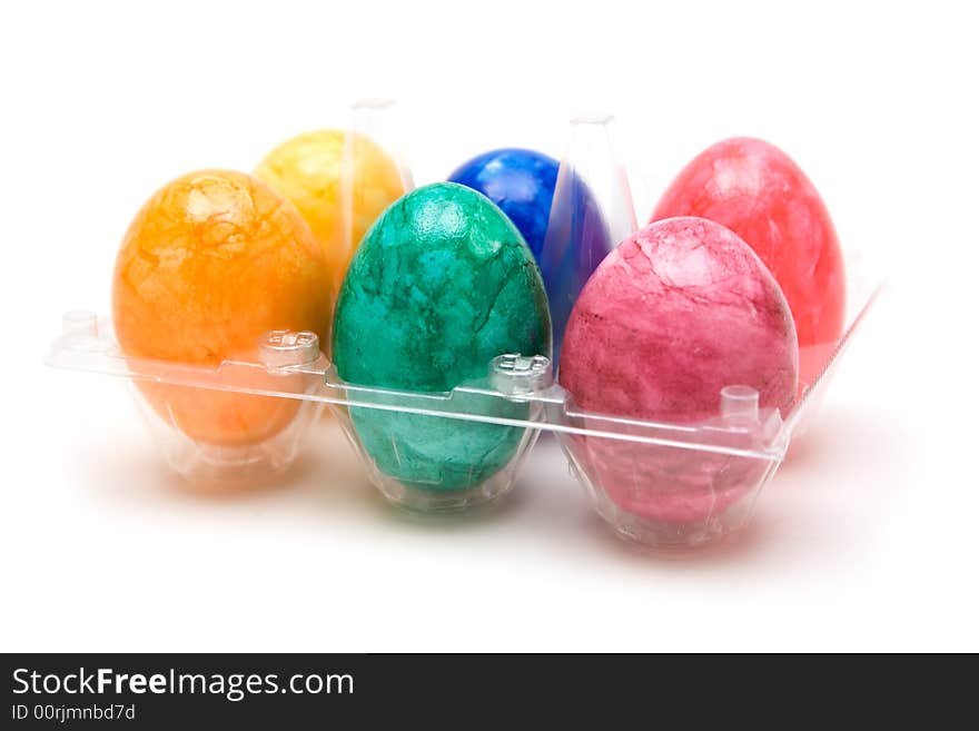 Pack of colorful eggs. White background. Pack of colorful eggs. White background.