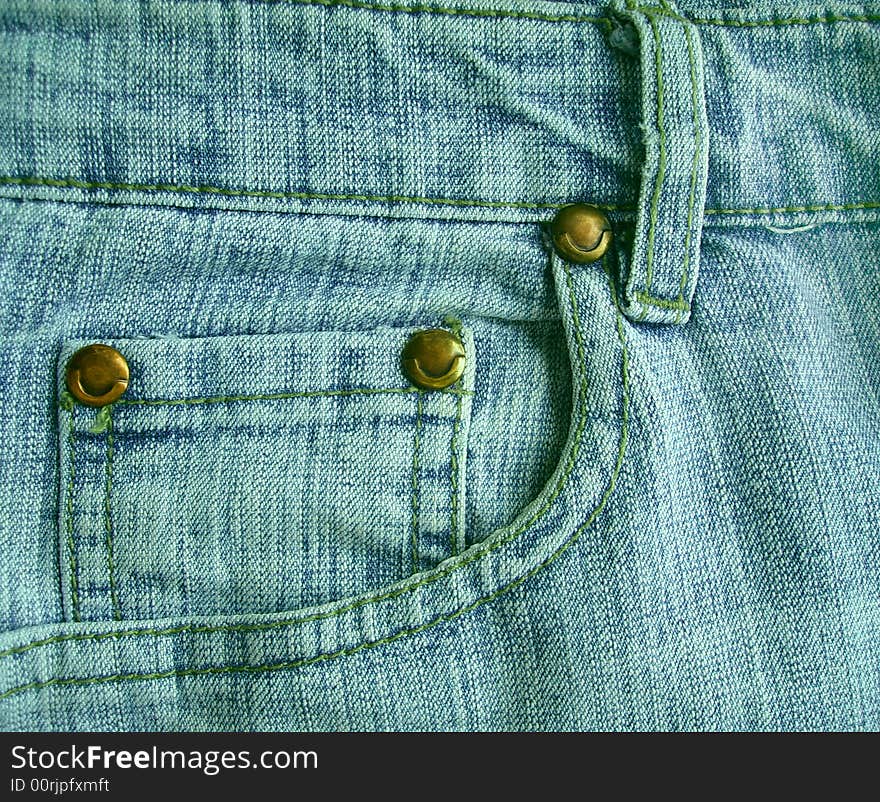 Background - a jeans pocket with metal buttons