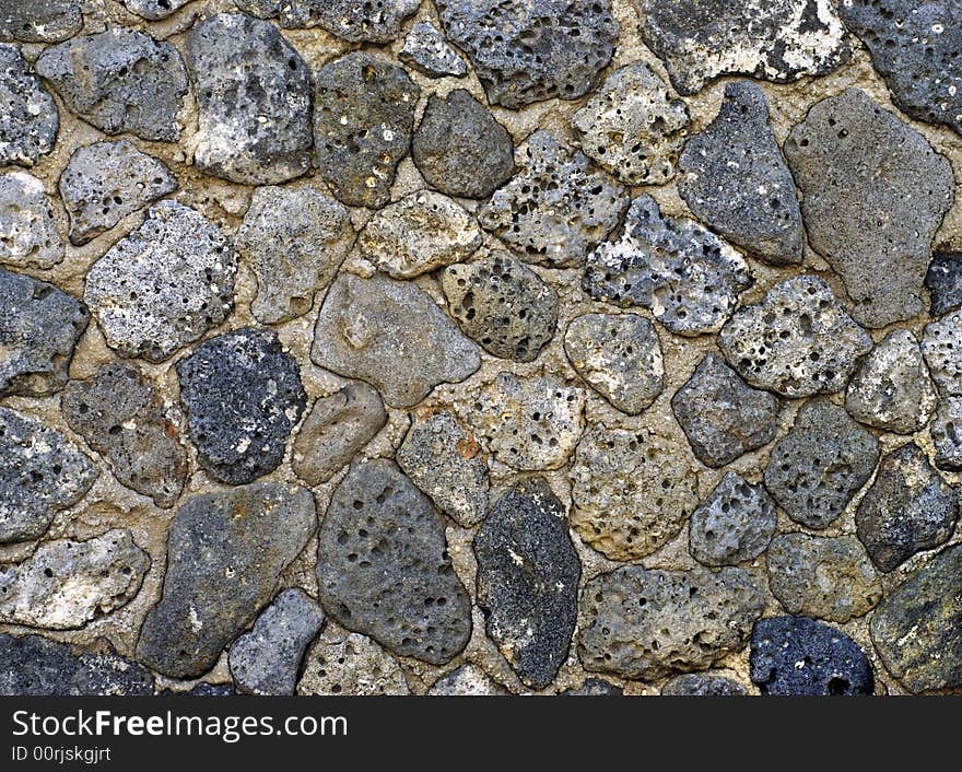 Fragment of old worn sea shell rocks stucco background. Fragment of old worn sea shell rocks stucco background