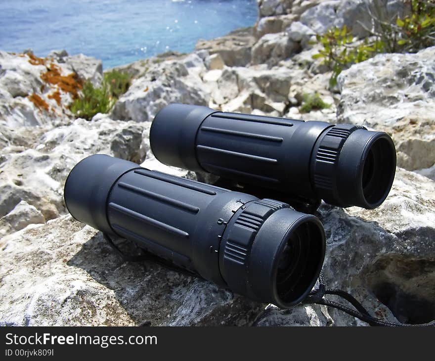 Hand-held binoculars used in exploration for viewing distant objects