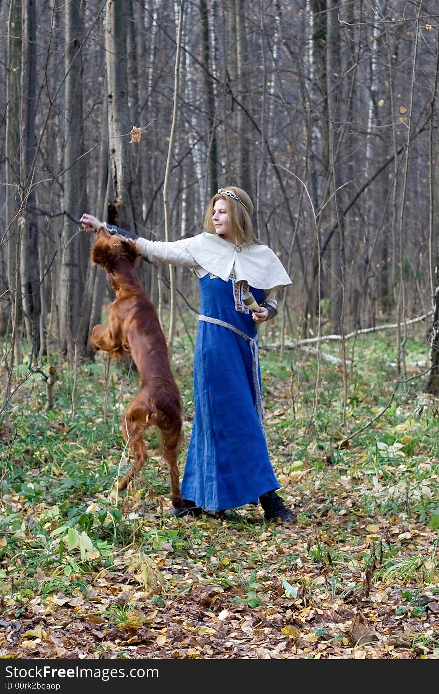 Portrait of the girl and irish setter in autumn forest. Portrait of the girl and irish setter in autumn forest.