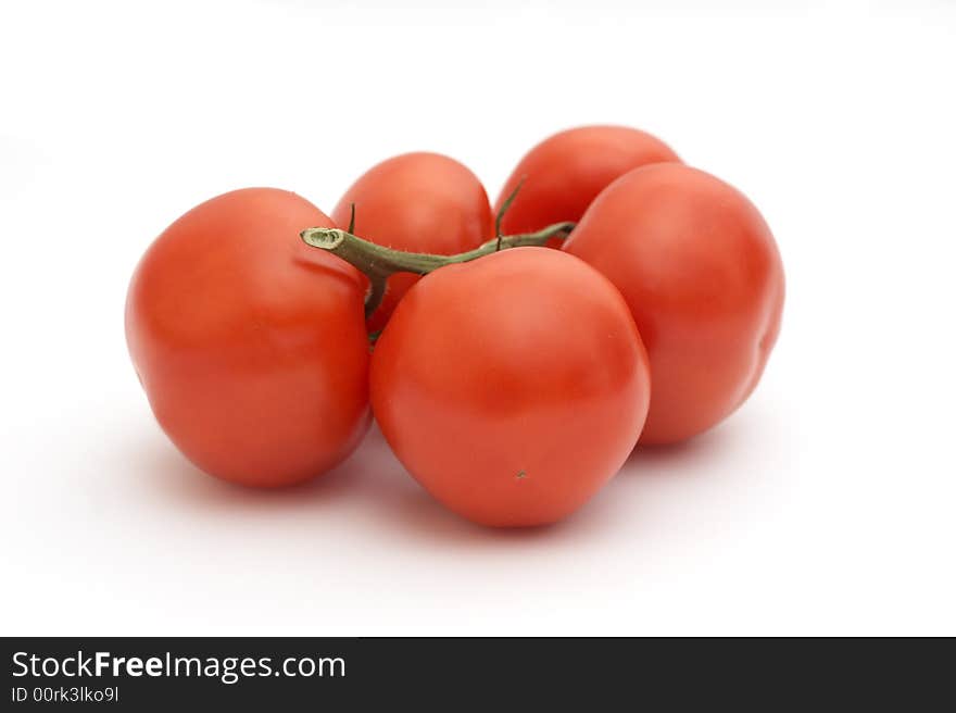 Red tomatoes on a white background