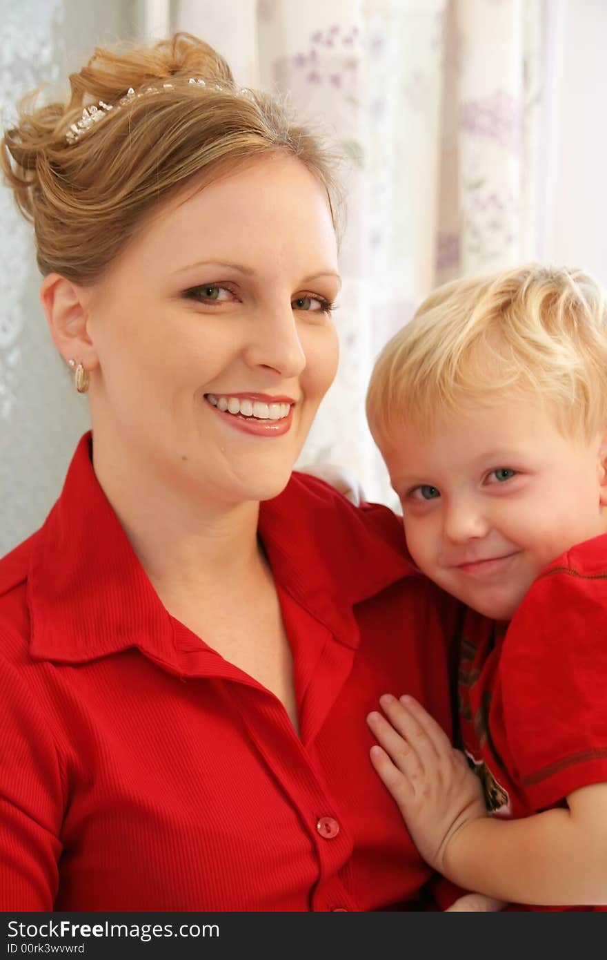 Beautiful bride helping son prepare for wedding day. Beautiful bride helping son prepare for wedding day