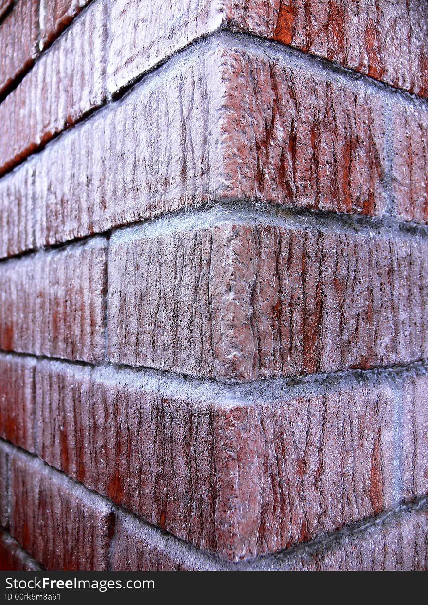 A Red Brick Wall Corner Covered With Ice. A Red Brick Wall Corner Covered With Ice