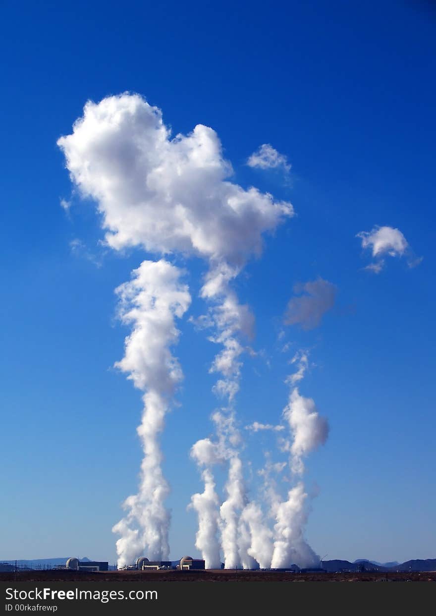 Steam rising into the sky from a desert power-plant. Steam rising into the sky from a desert power-plant