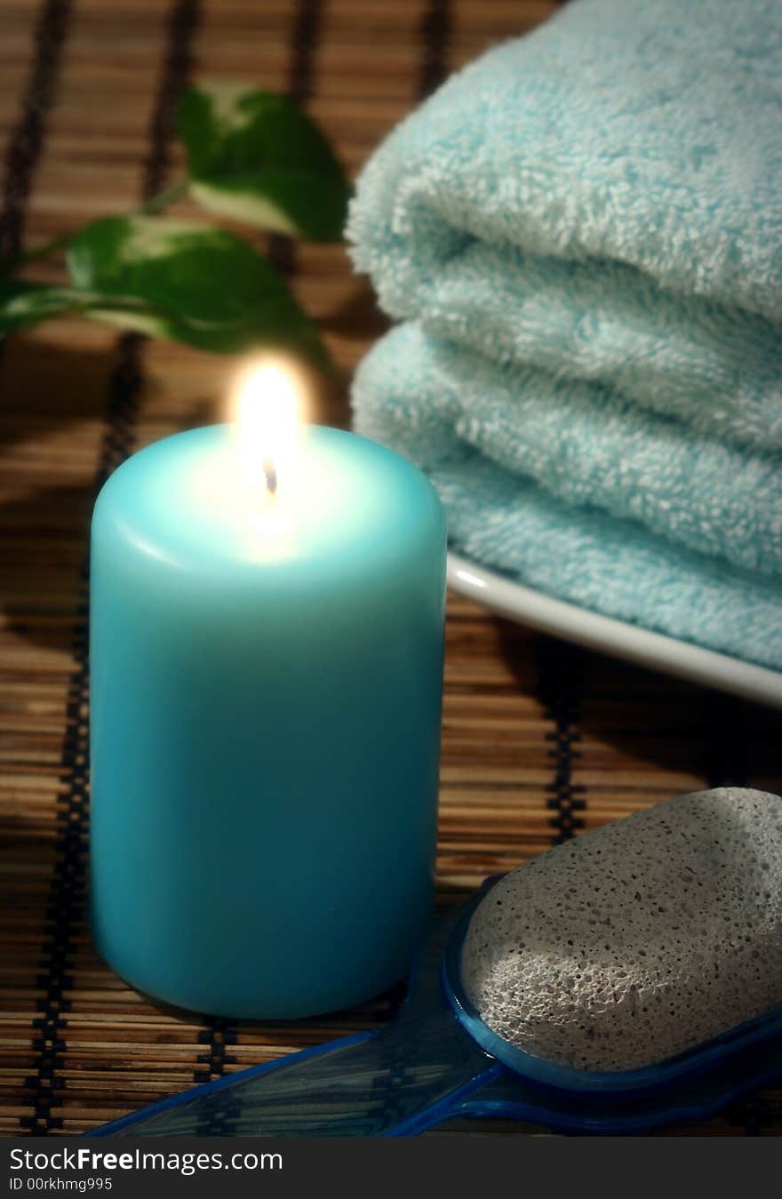 Blue candle and towel and pumice. Blue candle and towel and pumice