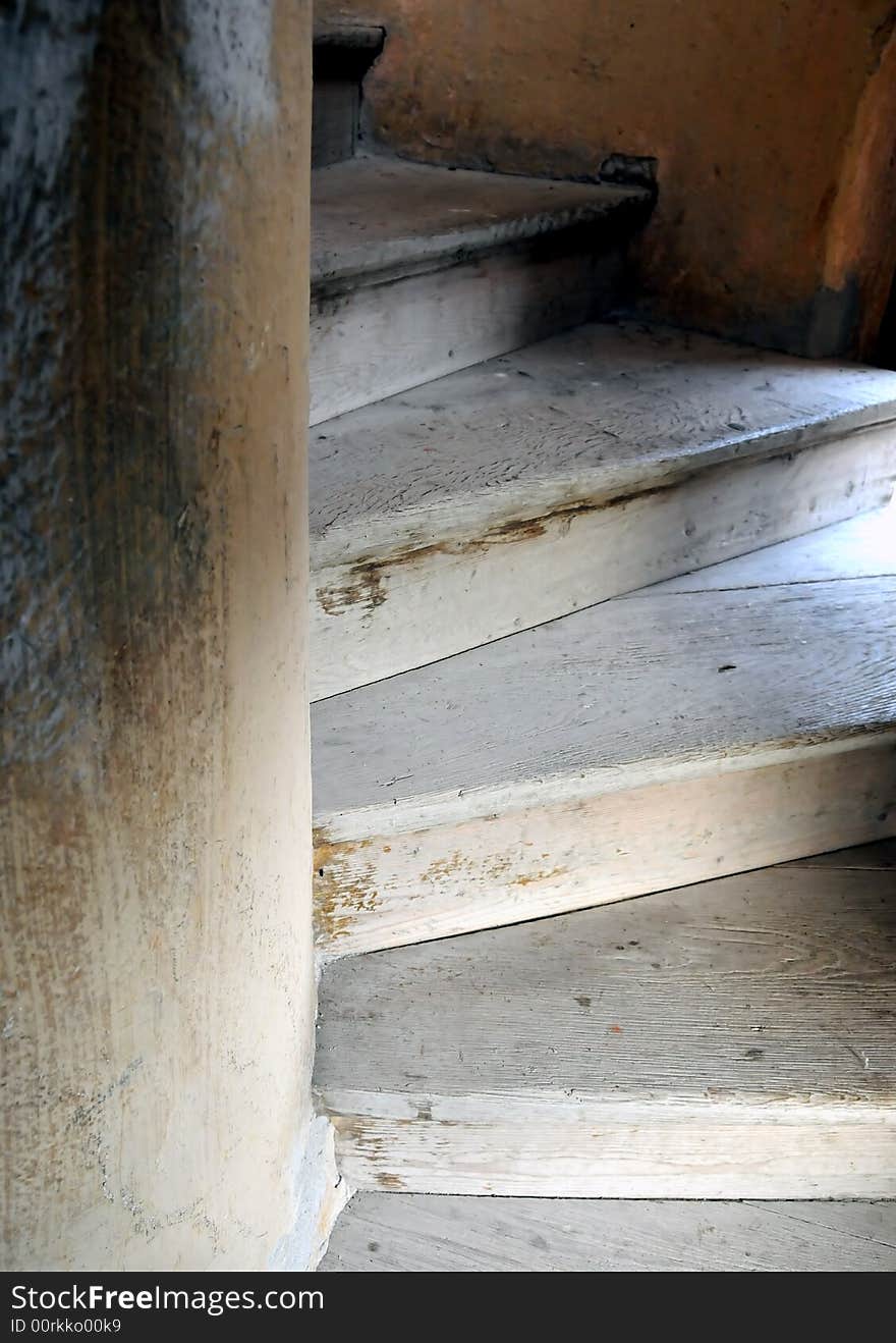 Old wooden spiral stairs in historical building. Old wooden spiral stairs in historical building