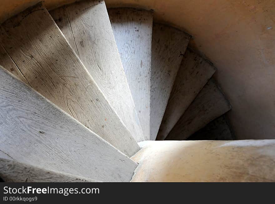 Old wooden spiral stairs in historical building. Old wooden spiral stairs in historical building