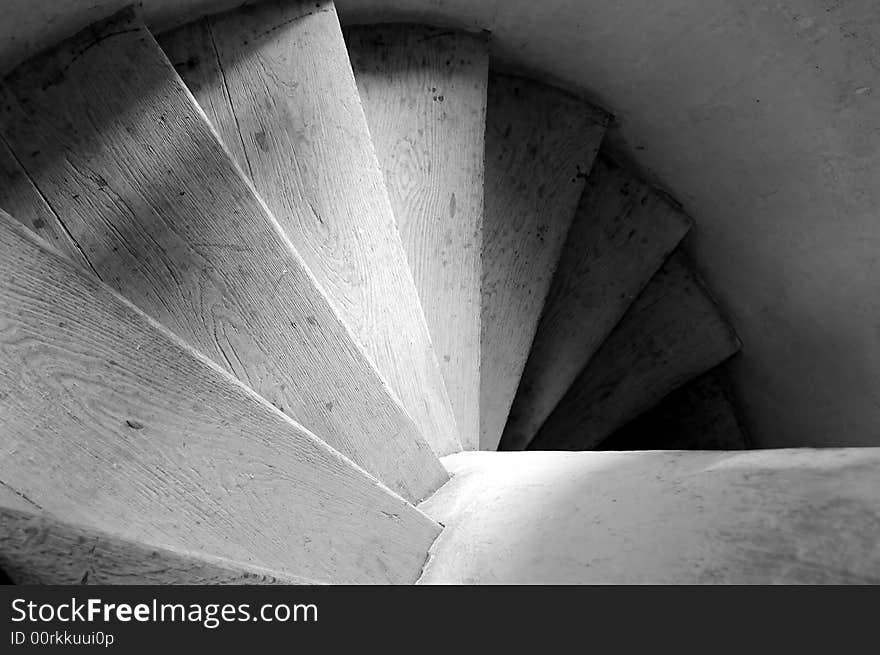 Old wooden spiral stairs in historical building. Old wooden spiral stairs in historical building