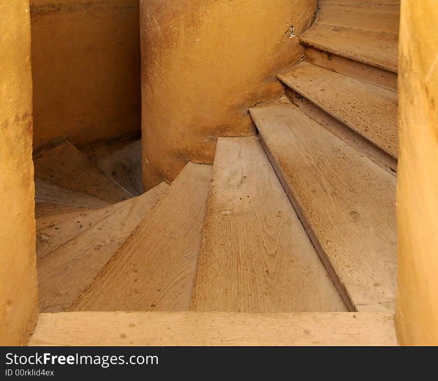 Old wooden spiral stairs in historical building. Old wooden spiral stairs in historical building