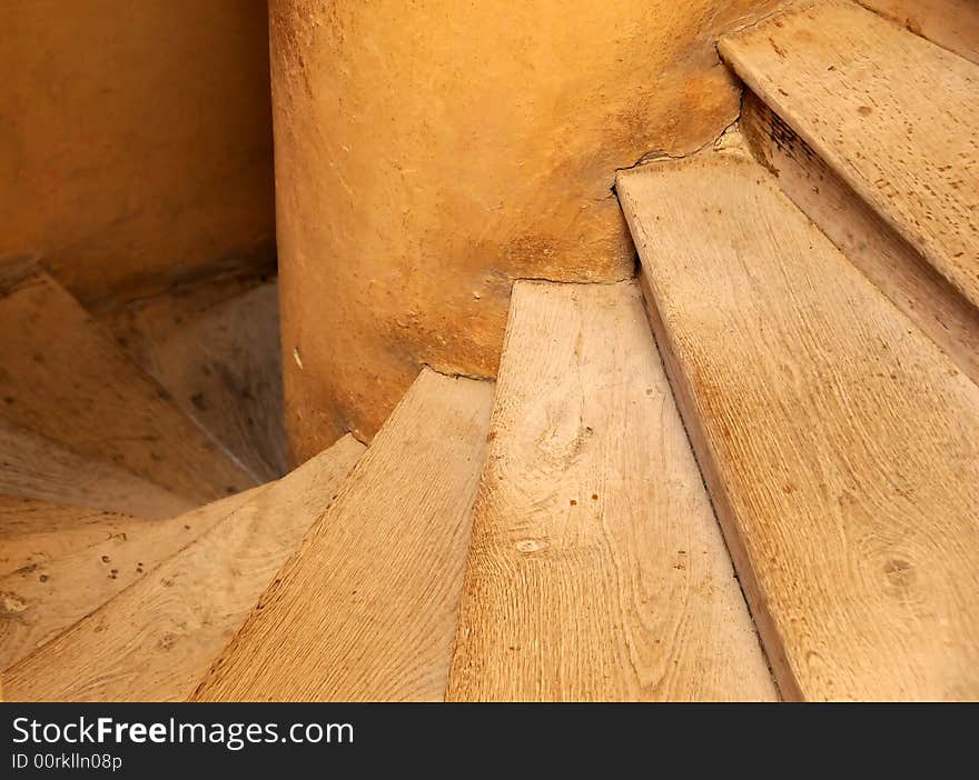 Old wooden spiral stairs in historical building. Old wooden spiral stairs in historical building