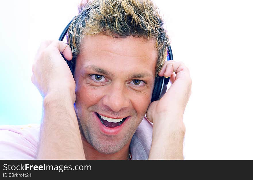 View of young  male listening music via earphones. Image may contain slight multicolor aberration as a part of design. View of young  male listening music via earphones. Image may contain slight multicolor aberration as a part of design