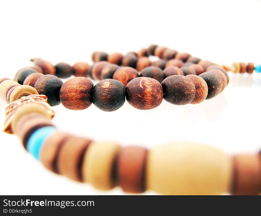 Wood amulet on white background