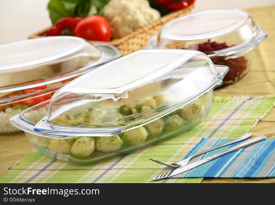 Dinner in oven-proofs dishes on the table