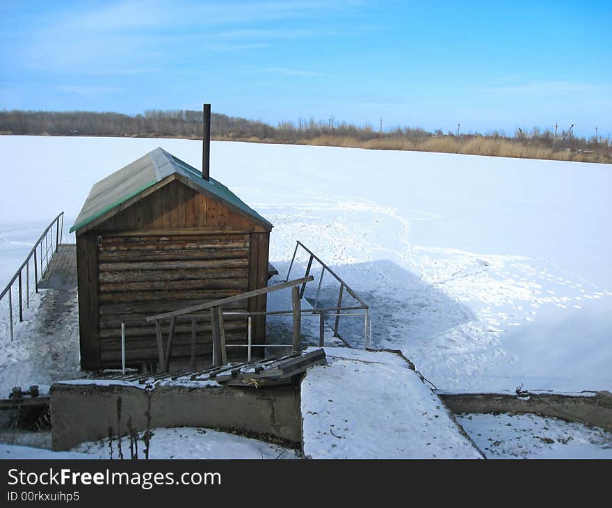 Wooden bathhouse on the lake. Wooden bathhouse on the lake