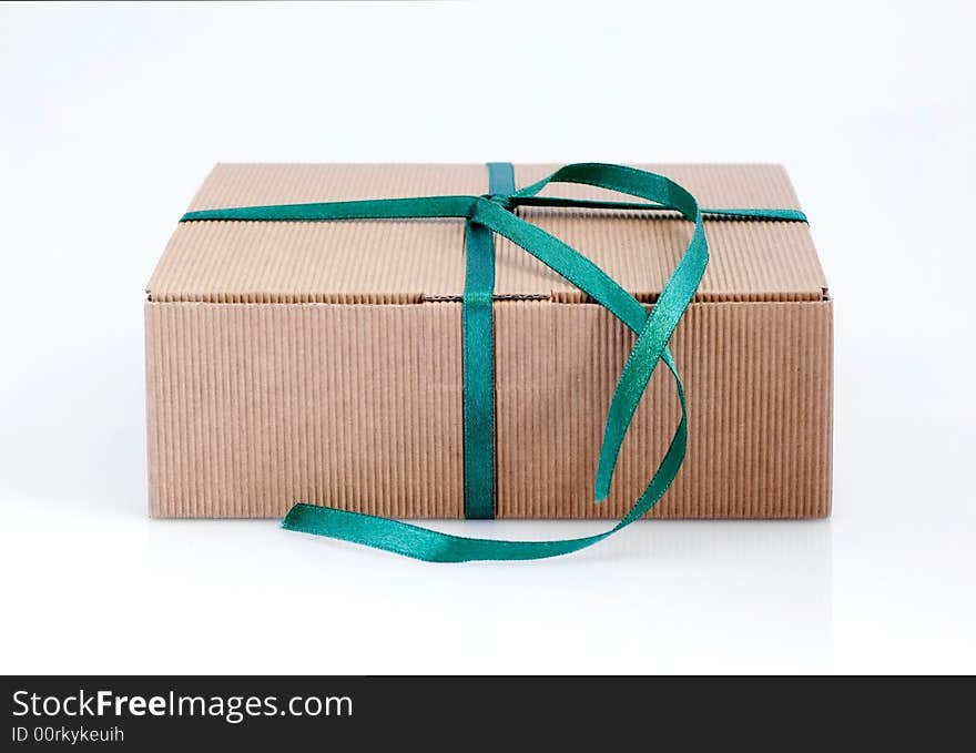 Easy to isolate closed paper box with green ribbon