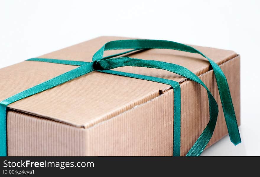 Easy to isolate closed paper box with green ribbon