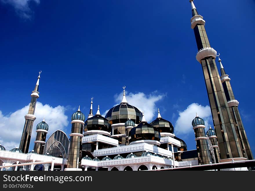 Mirror mosque on the blue sky background