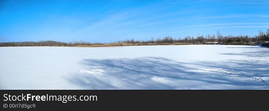 Sunny winter day on the ice lake. Sunny winter day on the ice lake