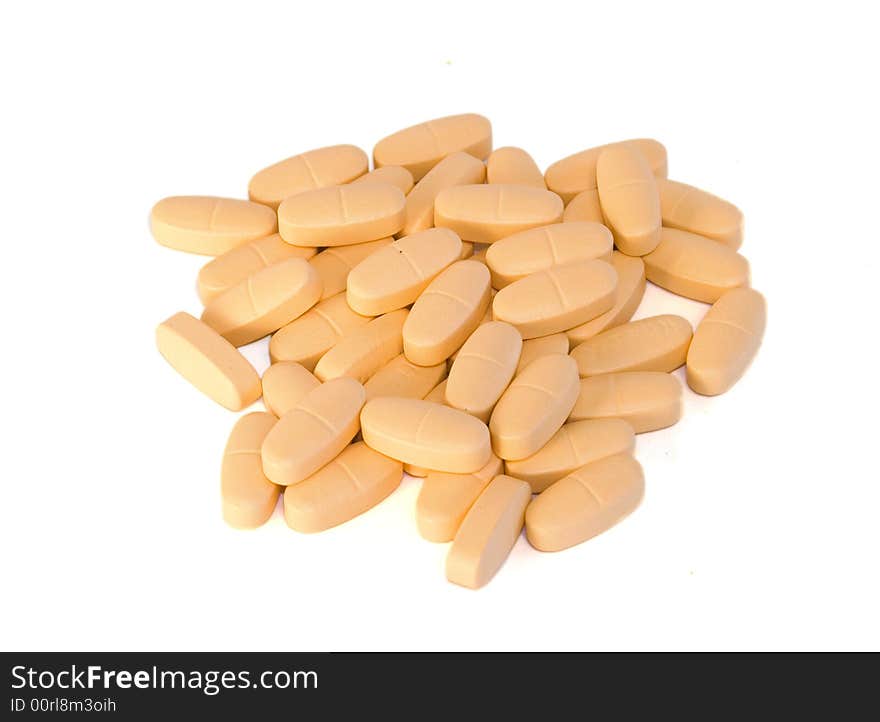 Pile of orange pills on white background. Pile of orange pills on white background