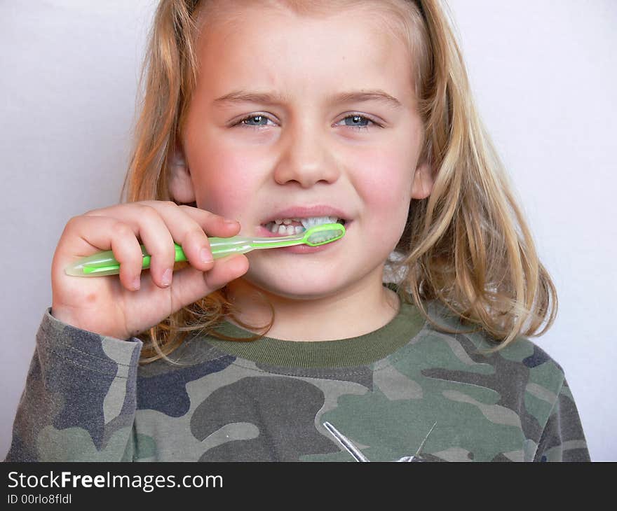 The child brushing the teeth. The child brushing the teeth