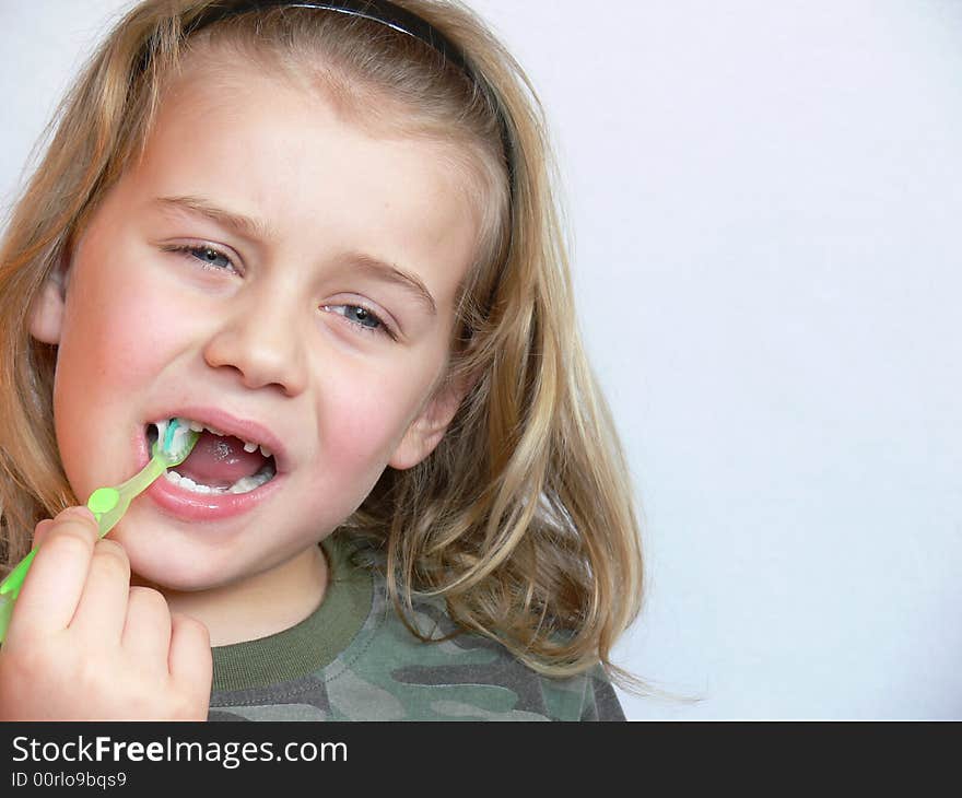 The child brushing the teeth. The child brushing the teeth