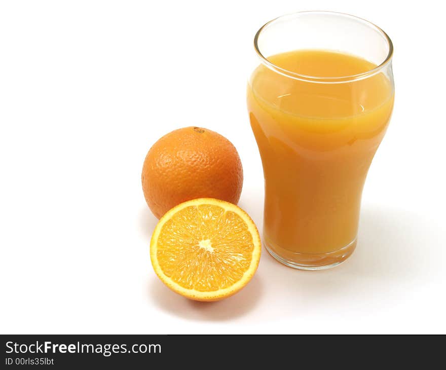 Oranges and glass of orange juice isolated on a white background