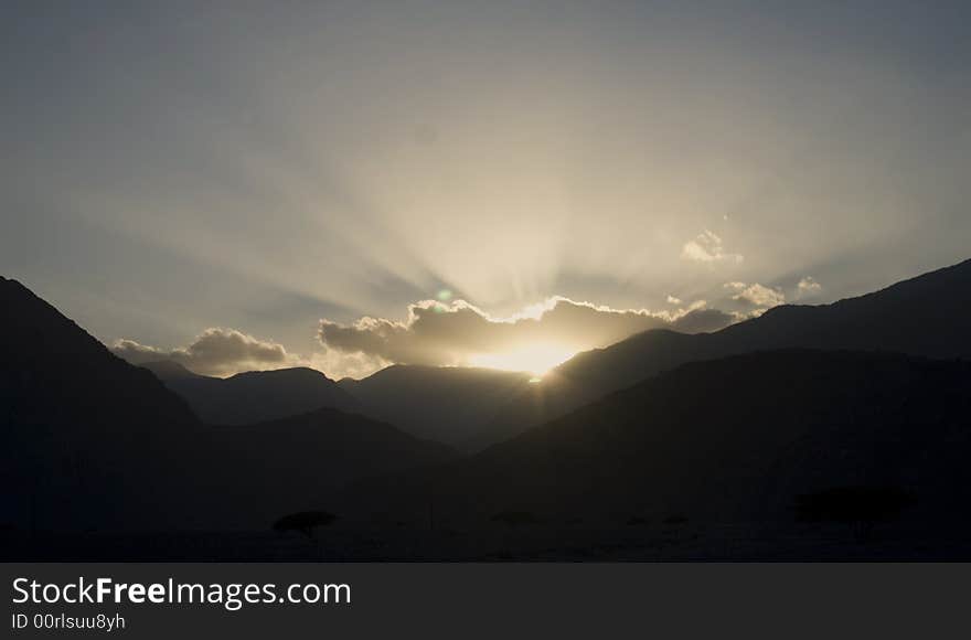 Sunset behind mountain