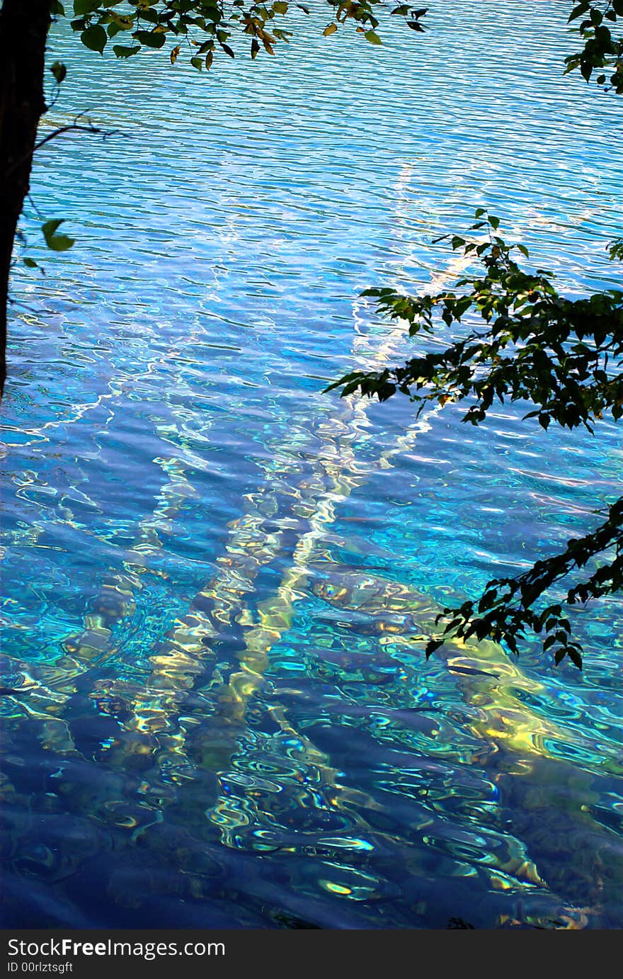 Lake in Jiuzaigou nature protection area, Sichuan province, South-West China. 

Jiuzaigou translates to: nine village valley.