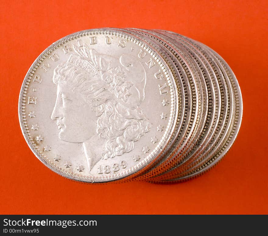 Closeup of a stack of Morgan silver US dollars. Closeup of a stack of Morgan silver US dollars.