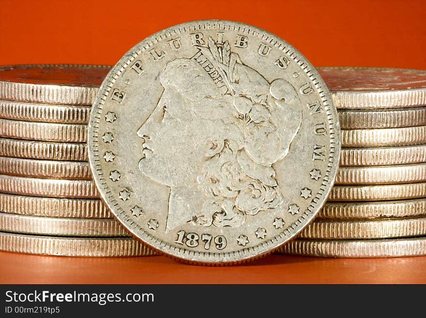 Closeup of two stacks of Morgan silver US dollars. Closeup of two stacks of Morgan silver US dollars.