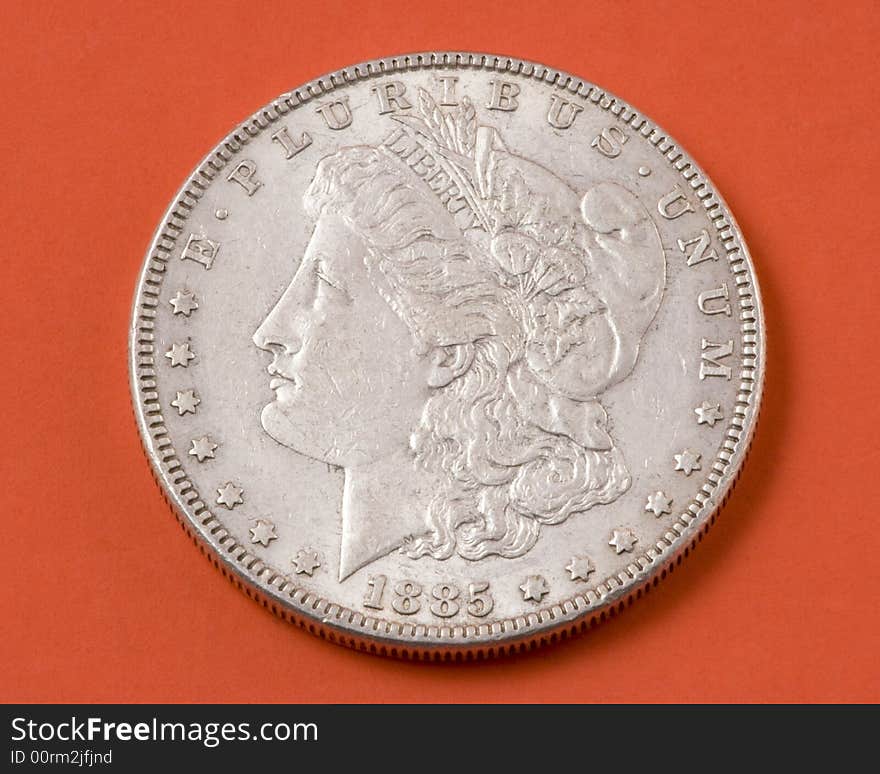 Closeup of a 1885 Morgan silver US dollar. Closeup of a 1885 Morgan silver US dollar.