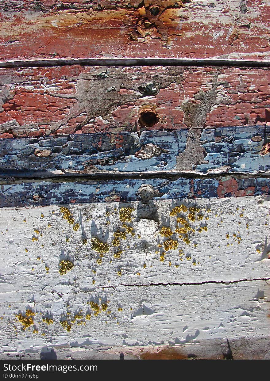 Red and blue cracked and peeling paint