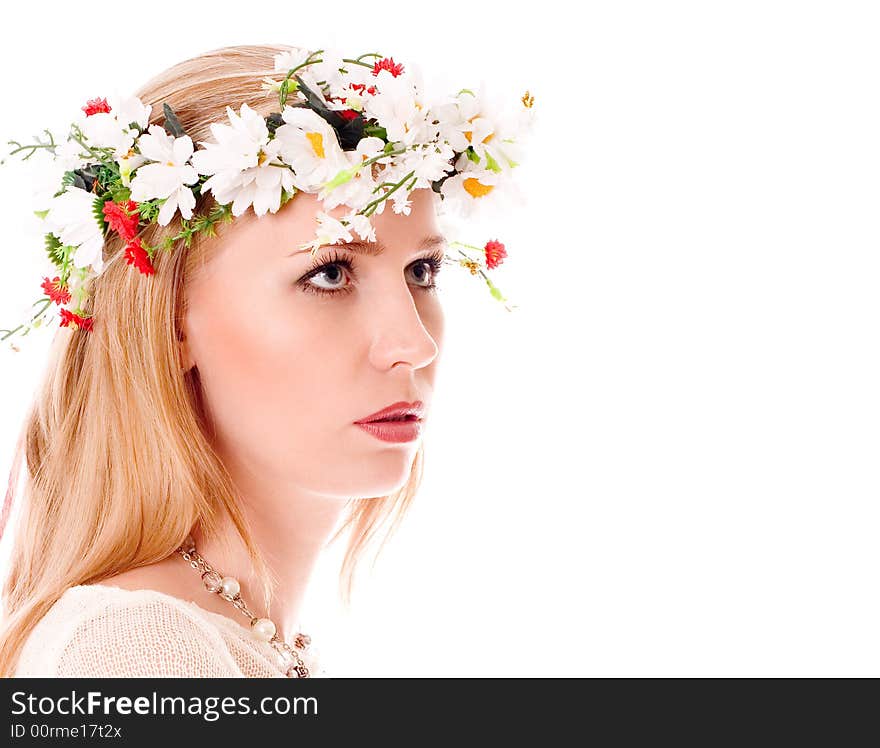 Pretty spring girl with wreath on head