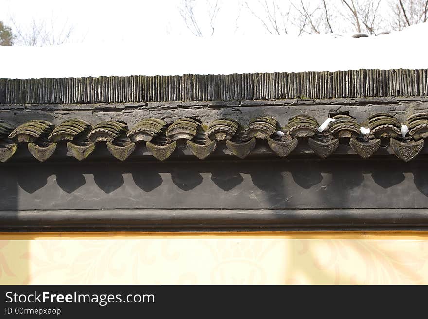 A very ancient eave of a buildingmade up with tiles.This picture is taken in the place of interest“Mooring by the Feng Bridge at night” in Suzhou ,China.