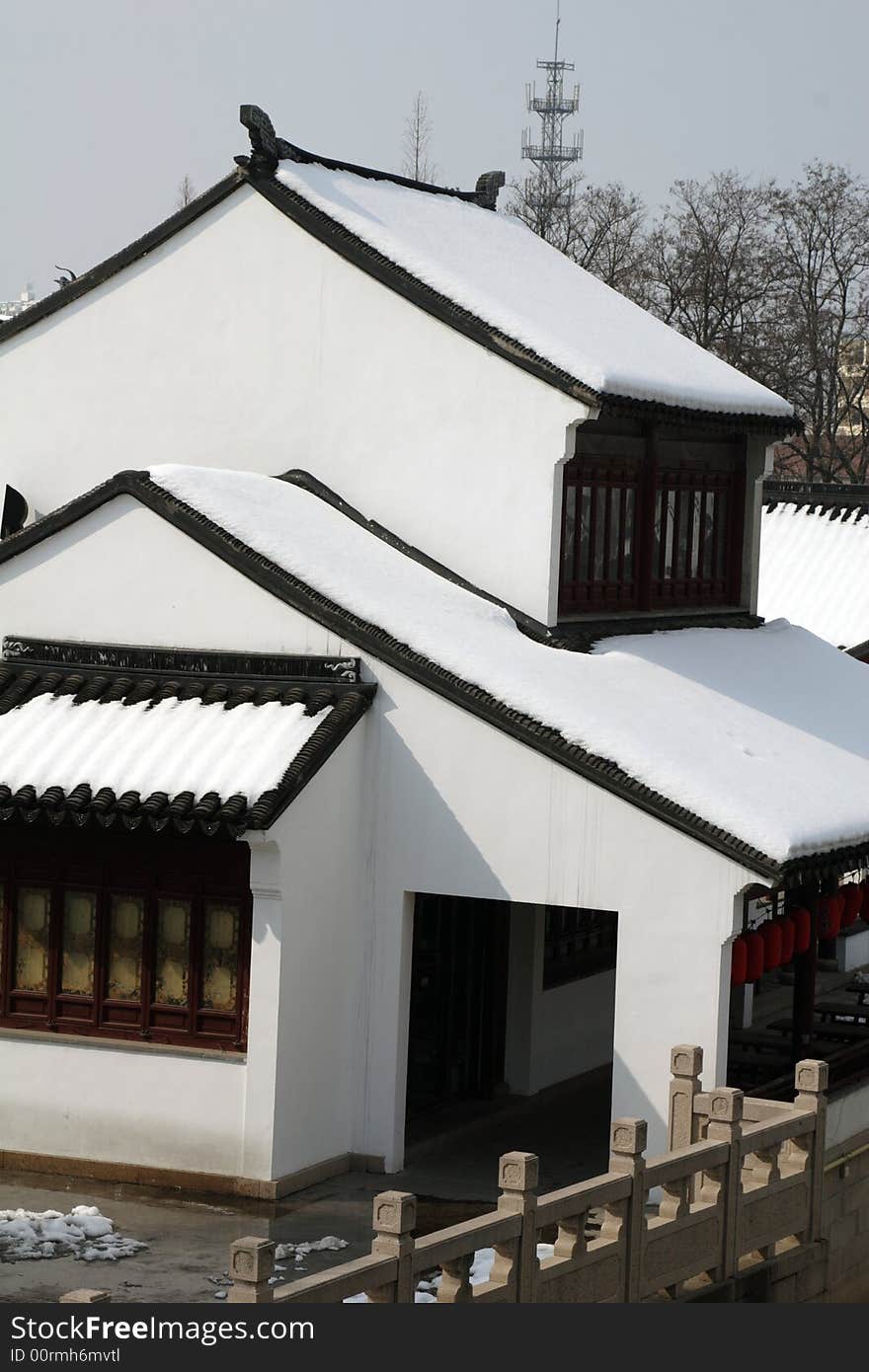 The beautiful and enjoyable snow scenery in the winter in the southern part of China. These sceneries are famous for their snow ,water, houses,and the blue sky.They are typical of the south in China.This picture is taken in the place of interest“Mooring by the Feng Bridge at night” in Suzhou ,China.