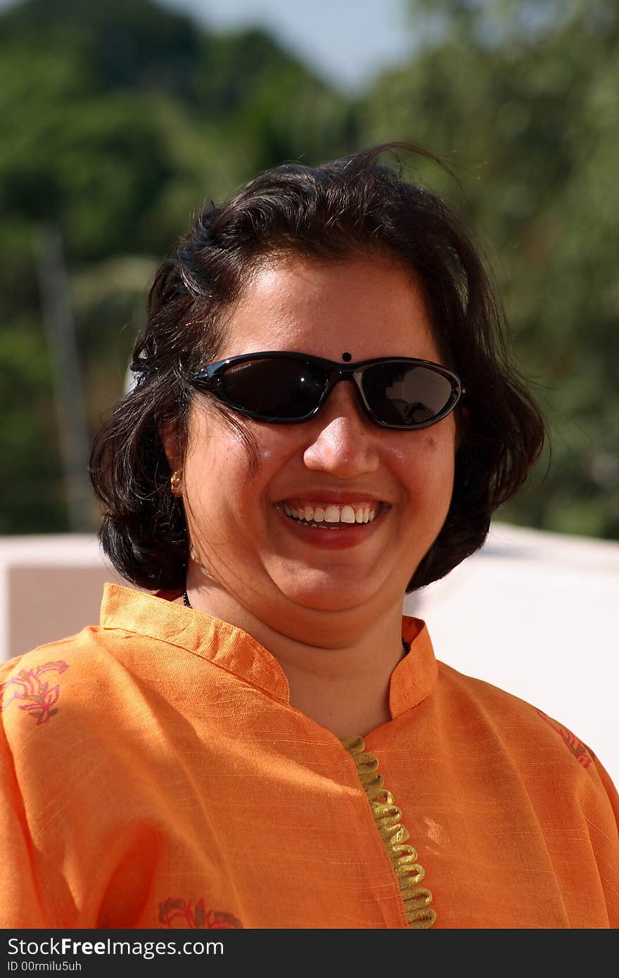 A handsome Indian woman smiling happily. A handsome Indian woman smiling happily.