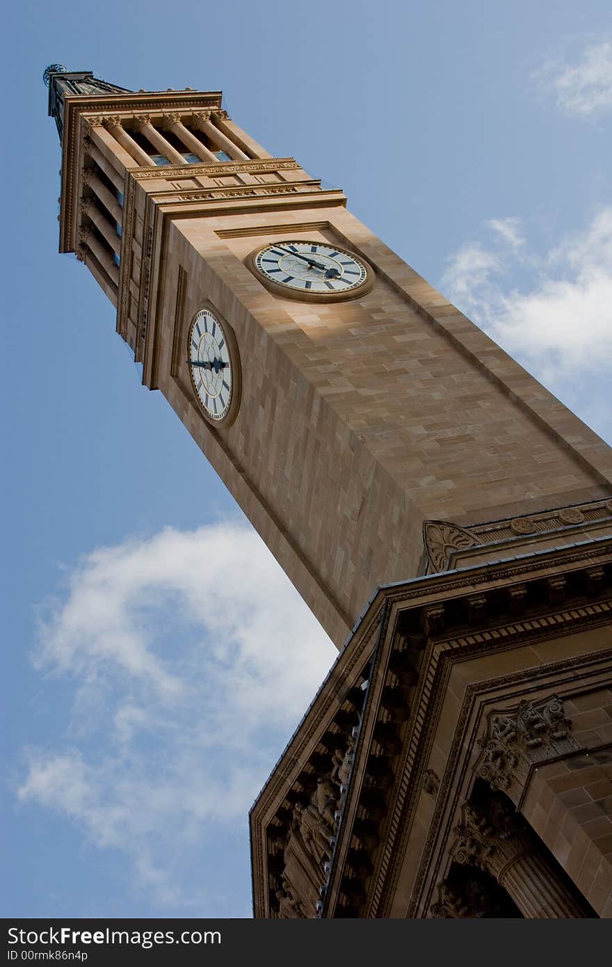 Brisbane City Hall clock tower against the blue sky. Brisbane City Hall clock tower against the blue sky