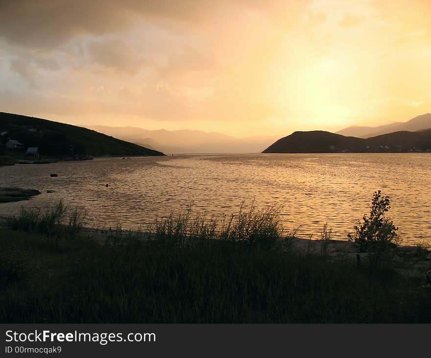 The beautiful sunset on the small beach. The beautiful sunset on the small beach