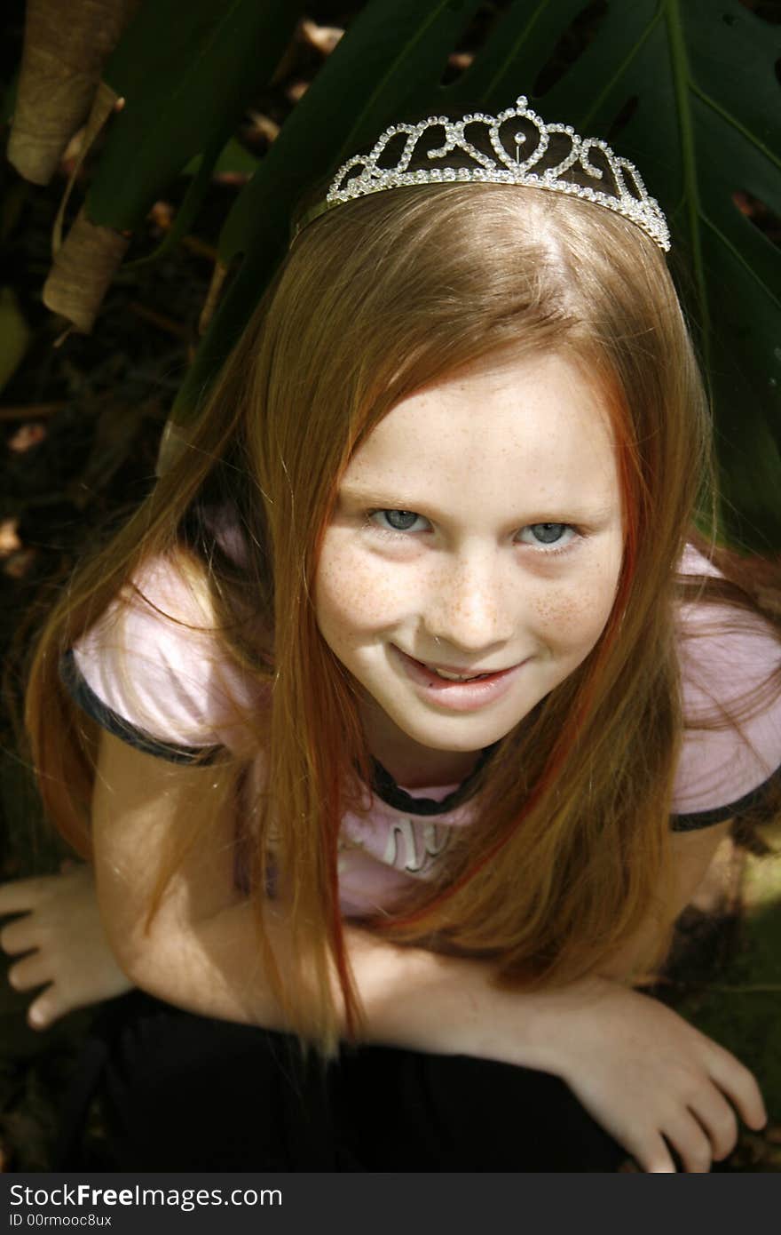 A white caucasian beauty wearing a tiara with a naughty expression on her face. A white caucasian beauty wearing a tiara with a naughty expression on her face