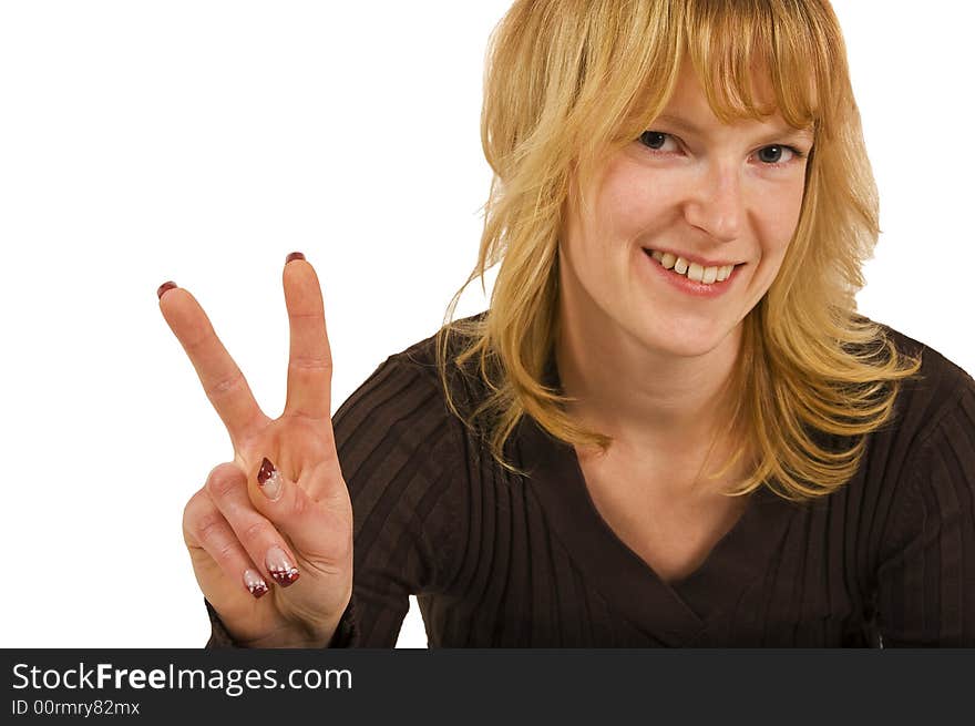 Blond woman showing a peace sign with fingers. Blond woman showing a peace sign with fingers