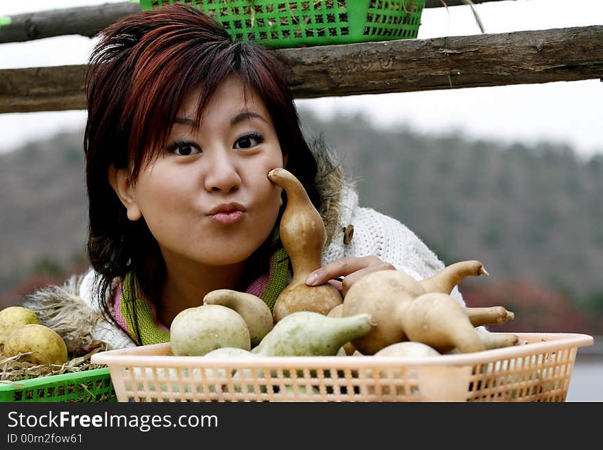 In autumn, the suburban happy girl in Beijing. Harvest of enjoying gold autumn.