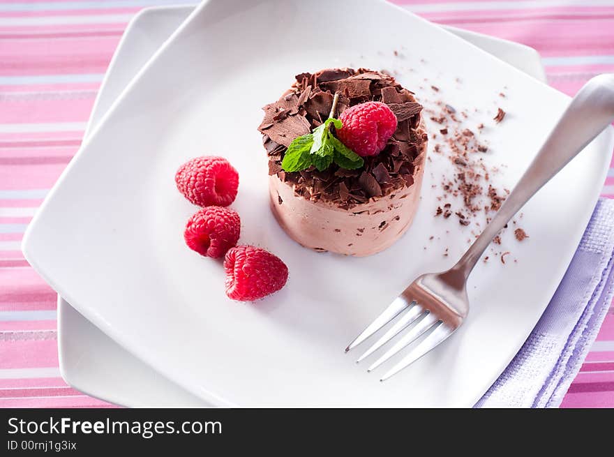 Chocolate Moose dessert on a white plate with milk